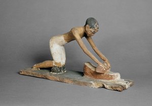 Model of a woman grinding corn, Egyptian, found at Sidmant